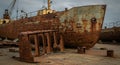 Shipwreck in Shipyard A Candid Study of Decay A rusting shipwreck sits in a shipyard symbolizing times passage decay Royalty Free Stock Photo