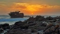 Shipwreck sunset rocks waves clouds shoreline