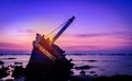 Shipwreck at sunset and twilight sky Royalty Free Stock Photo