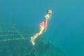 Diver looking at shipwreck under water, very old ship taken on the bottom of the sea, Zavratnica Croatia Royalty Free Stock Photo