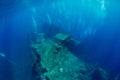 Shipwreck in underwater with air bubbles. Diving in ocean Royalty Free Stock Photo