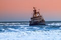 Shipwreck in wild Atlantic Ocean at Skeleton Coast, Namibia, Africa Royalty Free Stock Photo