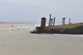 A shipwrecked barge abandoned long ago on the beach