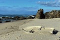 Wrecked small boat on a beach filled with sand Royalty Free Stock Photo