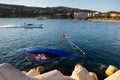 Shipwrecked half-submerged yacht in the calm waters of the Bay of Mallorca
