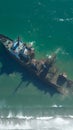 Shipwrecked tanker abandoned by coast, hinting at maritime past