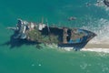 Shipwrecked tanker abandoned by coast, hinting at maritime past