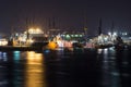 Shipyard dockyard with container ships in harbor of Hamburg at night