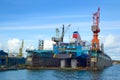 Shipyards and docks with cranes and other heavy machinery near in industrial part of old town Gdansk, Baltic coast, Gdansk bay, Po Royalty Free Stock Photo