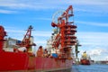 Shipyards and docks with cranes and other heavy machinery near in industrial part of old town Gdansk, Baltic coast, Gdansk bay, Po Royalty Free Stock Photo