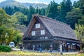 Shirakawa, Gifu, Japan - October 2022 - Unidentified Japanese with a background of Shirakawago village during autumn with a triang