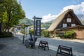 Shirakawago, Gifu, Japan - Ocotber 2022 - Shirakawa Hachiman Shrine gate area at Shirakawago village with pine trees and Japanese