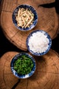 Shirataki rice or noodles, shimeji mushrooms and wakame in bowl on wooden table background. Konnyaku from konjac yam