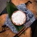 Shirataki rice or noodles on wooden table background. Konnyaku from konjac yam for wok. Healthy japanese diet. Gluten free, KETO