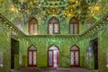 Shiraz, Iran - 04.14.2019: Interior of famous Green Mosque in Shiraz, Iran. Million green mirrors. Shah Cheragh mosque.