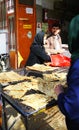 Iranian people buy flatbread Sangak from a baker. Shiraz, Iran. Royalty Free Stock Photo