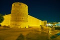 SHIRAZ, IRAN - OCTOBER 14, 2017: Enjoy medieval Karim Khan Citadel in bright evening illumination, surrounded by pleasant gardens