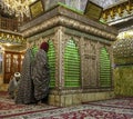 Shiraz, Iran - 2019-04-09 - Shah Ceragh Shrine - men pray at mirrored tomb of mullah