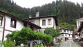 Shiroka Laka a village in southern Bulgaria, Smolyan District. Old traditional stone house and wooden doors. Street view.