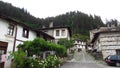 Shiroka Laka a village in southern Bulgaria, Smolyan District. Old traditional stone house and wooden doors. Street view.