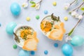 Shirred eggs Oeuf cocotte or baked eggs with green asparagus with Easter bunny and eggs Royalty Free Stock Photo