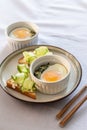 Shirred eggs Oeuf cocotte or baked eggs. healthy breakfast with eggs and spinach and toast with cucumber Royalty Free Stock Photo