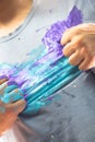 Shirt and hand dirty with paint in a dramatic superhero pose as handmade creative artistic hero