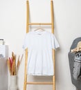 A shirt hanged on to a ladder with minimalistic decorations Royalty Free Stock Photo