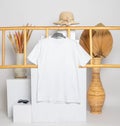 A shirt hanged on to a ladder with minimalistic decorations Royalty Free Stock Photo