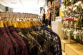 Shirt and pant hanging on hangers on a clothing rack and arranged in shelf in a modern clothe store Royalty Free Stock Photo