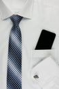 Shirt, tie, cuff links and a mobile phone Royalty Free Stock Photo