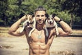 Shirtless Athletic Man with Dogs on his Shoulders