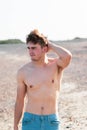 Shirtless on a beach