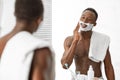 Black Man Applying Shaving Foam Standing Near Mirror At Home Royalty Free Stock Photo