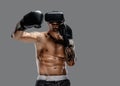 Shirtless brutal boxing fighter in virtual reality glasses.