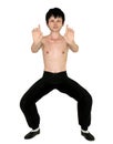 Shirtless Chinese Boy Striking A Kung Fu Pose