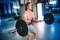 Shirtless fitness man working out with barbell in fitness gym