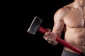 Shirtless guy holding a sledgehammer