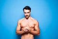 Shirtless man with beard on blue background Royalty Free Stock Photo