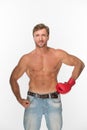 Shirtless man with a boxing glove over white