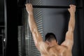 Shirtless man doing pull up Royalty Free Stock Photo