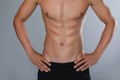 Shirtless man with slim body on grey background, closeup Royalty Free Stock Photo