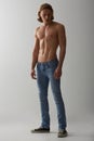 Shirtless, model and man in jeans on studio, white background and mockup with fashion. Male, beauty and handsome topless