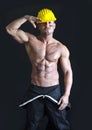 Shirtless muscular construction worker wearing coverall and hardhat Royalty Free Stock Photo