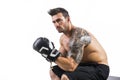 Shirtless and muscular man with boxer`s gloves Royalty Free Stock Photo