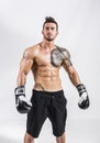 Shirtless and muscular man with boxer`s gloves Royalty Free Stock Photo