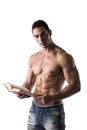 Shirtless Muscular Man Reading Big Book Royalty Free Stock Photo