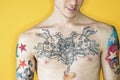 Shirtless tattooed male chest.