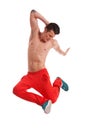 Shirtless young dancer jumping