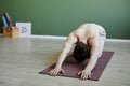 Shirtless young man doing yoga and relaxing in Balasana Royalty Free Stock Photo